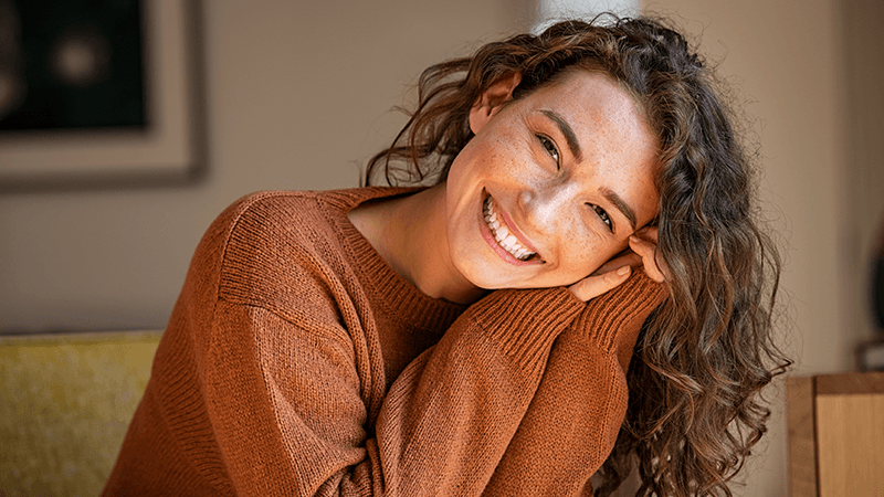 Person feeling positive after online therapy